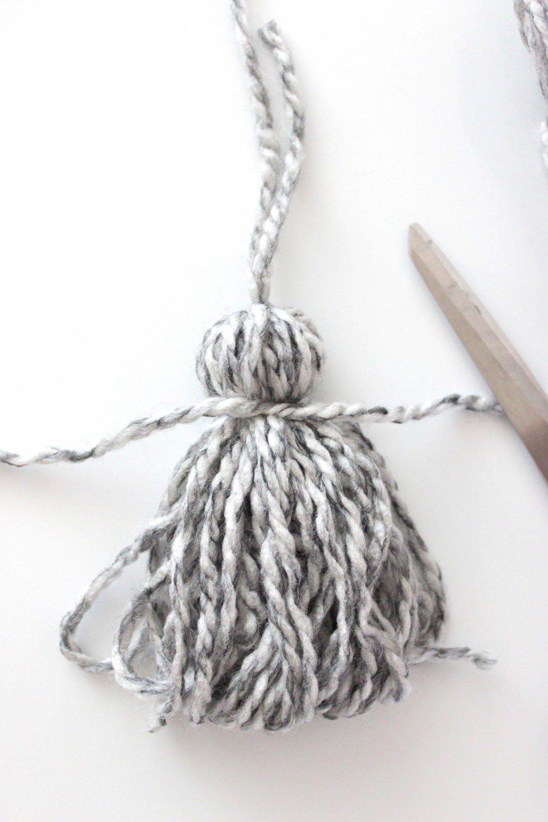 DIY Yarn Twig Wall Decor with Tassels | Rebecca Propes Design & DIY