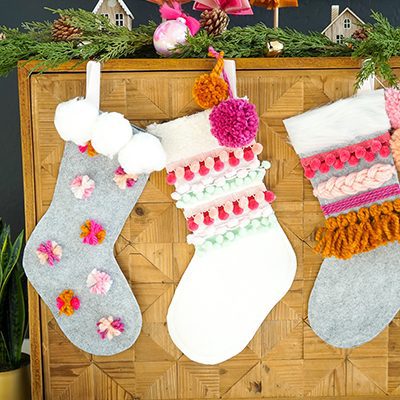 DIY Colorful Pom and Yarn Holiday Stockings